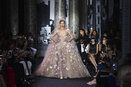 A model wears a creation as part of Elie Saab's fall-winter 2016-2017 Haute Couture fashion collection, presented in Paris, France, Wednesday July 6, 2016. (AP Photo/Zacharie Scheurer)