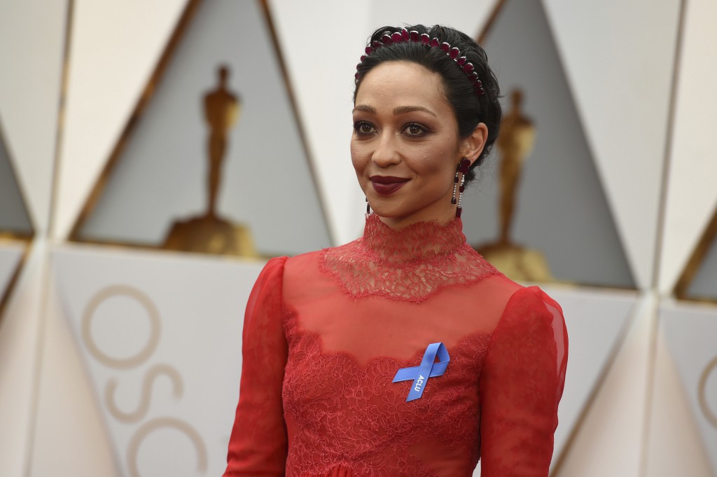 Ruth Negga wears an ACLU ribbon as she arrives at the Oscars on Sunday, Feb. 26, 2017, at the Dolby Theatre in Los Angeles. (Photo by Jordan Strauss/Invision/AP)