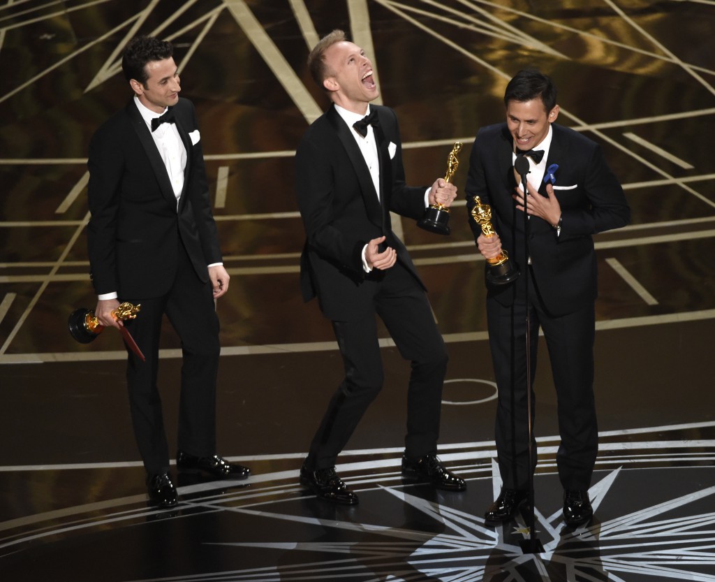 Justin Hurwitz, from left, Justin Paul, and Benj Pasek accept the award for best original song for "City of Stars" from "La La Land" at the Oscars on Sunday, Feb. 26, 2017, at the Dolby Theatre in Los Angeles. (Photo by Chris Pizzello/Invision/AP)